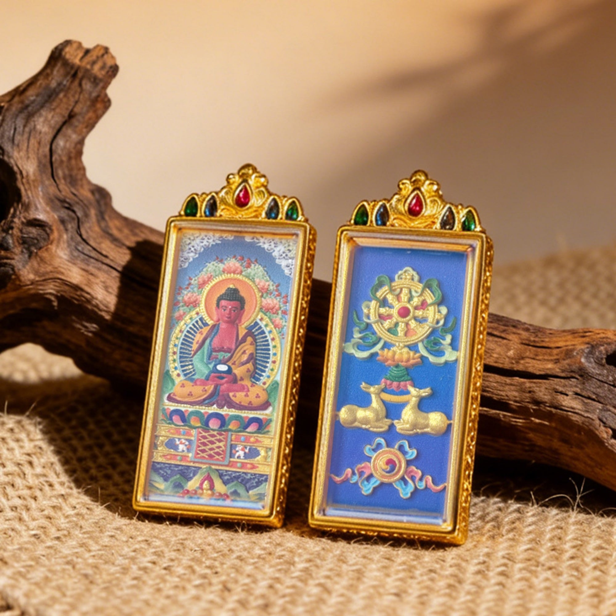 Two ornate religious icons with gold frames on a textured surface.