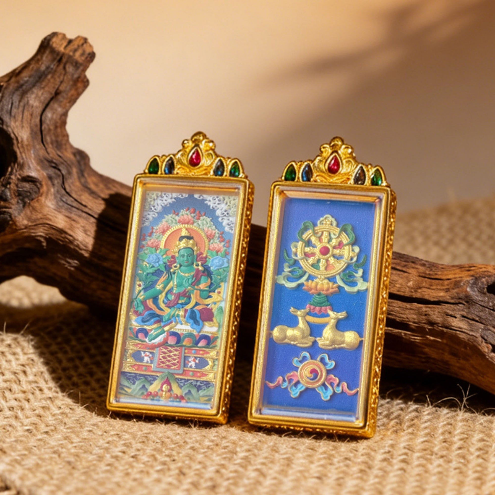 Two ornate religious artworks on a textured surface with wooden elements.