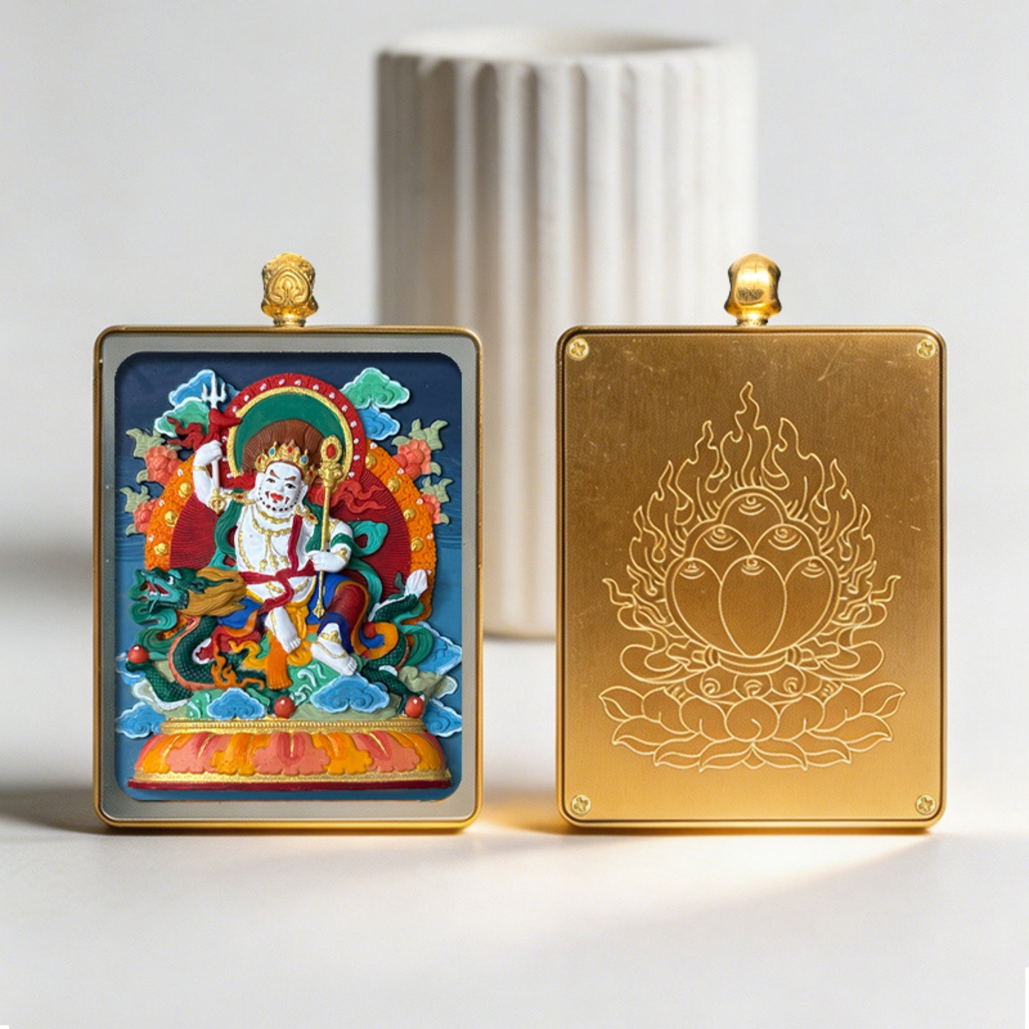Two decorative panels, one with a colorful religious figure and the other with a gold emblem, on a light background.
