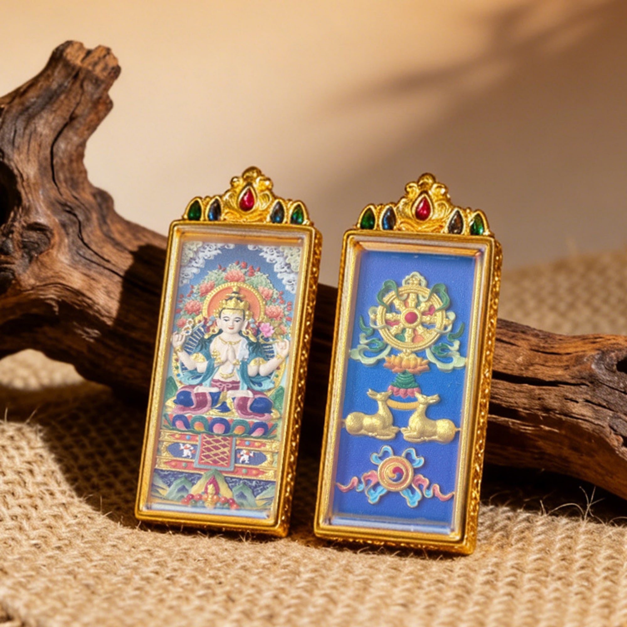 Two ornate religious artworks with gold frames on a textured surface.