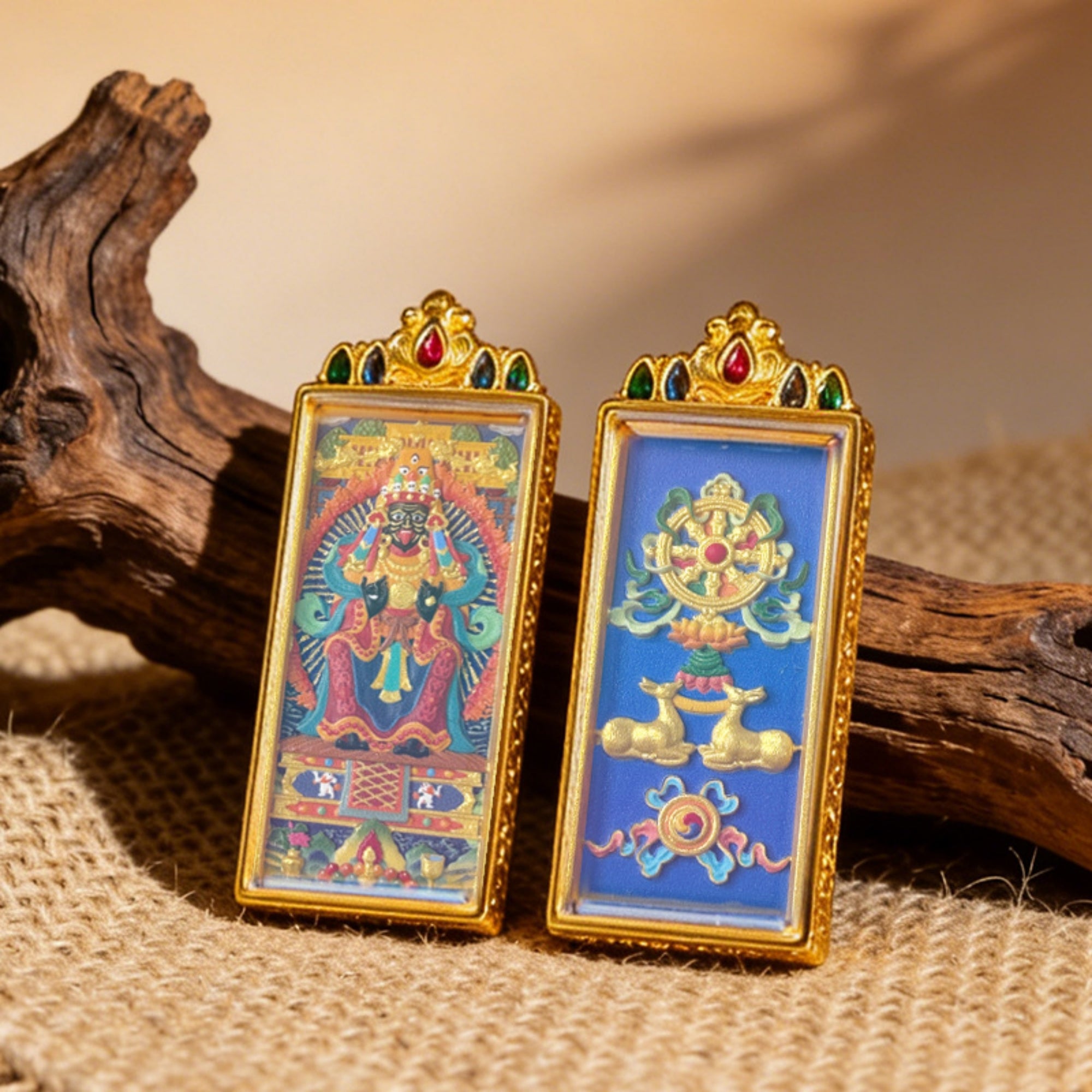 Two ornate religious artifacts on a textured surface with wooden elements.