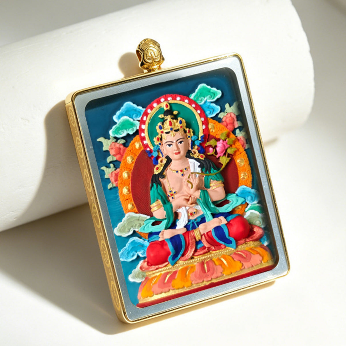 Colorful religious icon in a gold frame on a white background