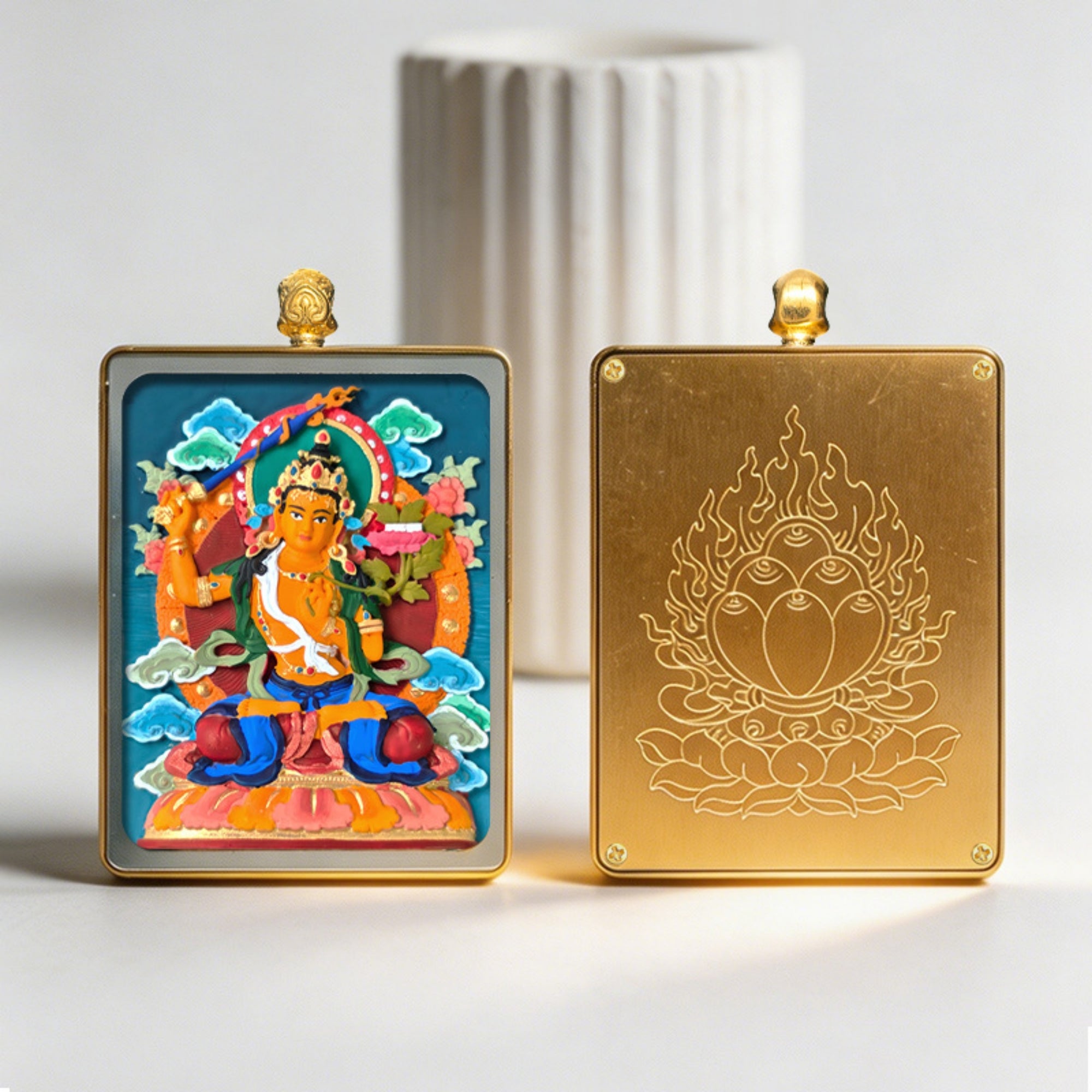 Two decorative plaques, one with a colorful religious figure and the other with a gold emblem, on a light background.