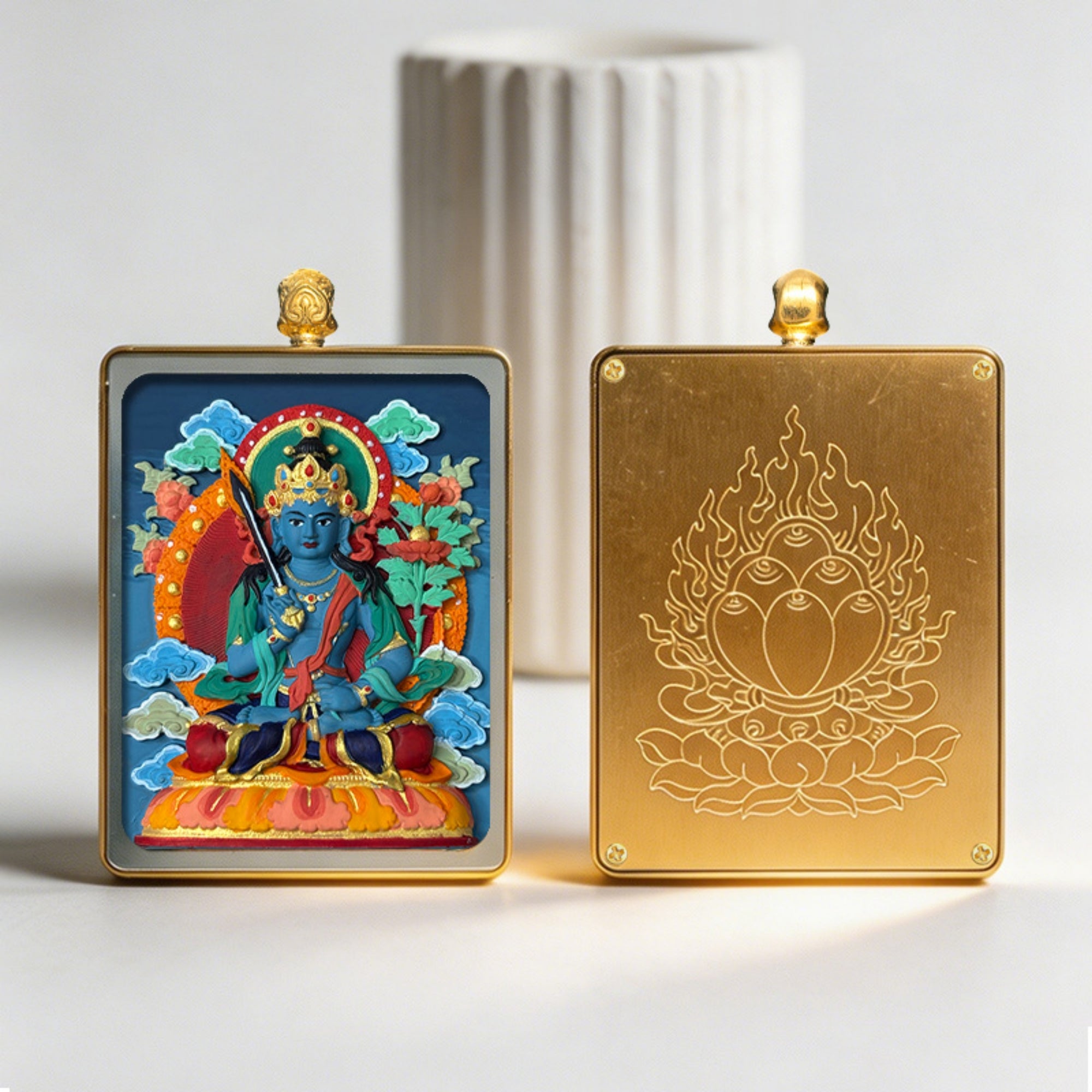 Two decorative panels, one with a colorful deity illustration and the other with a gold emblem, on a light background.
