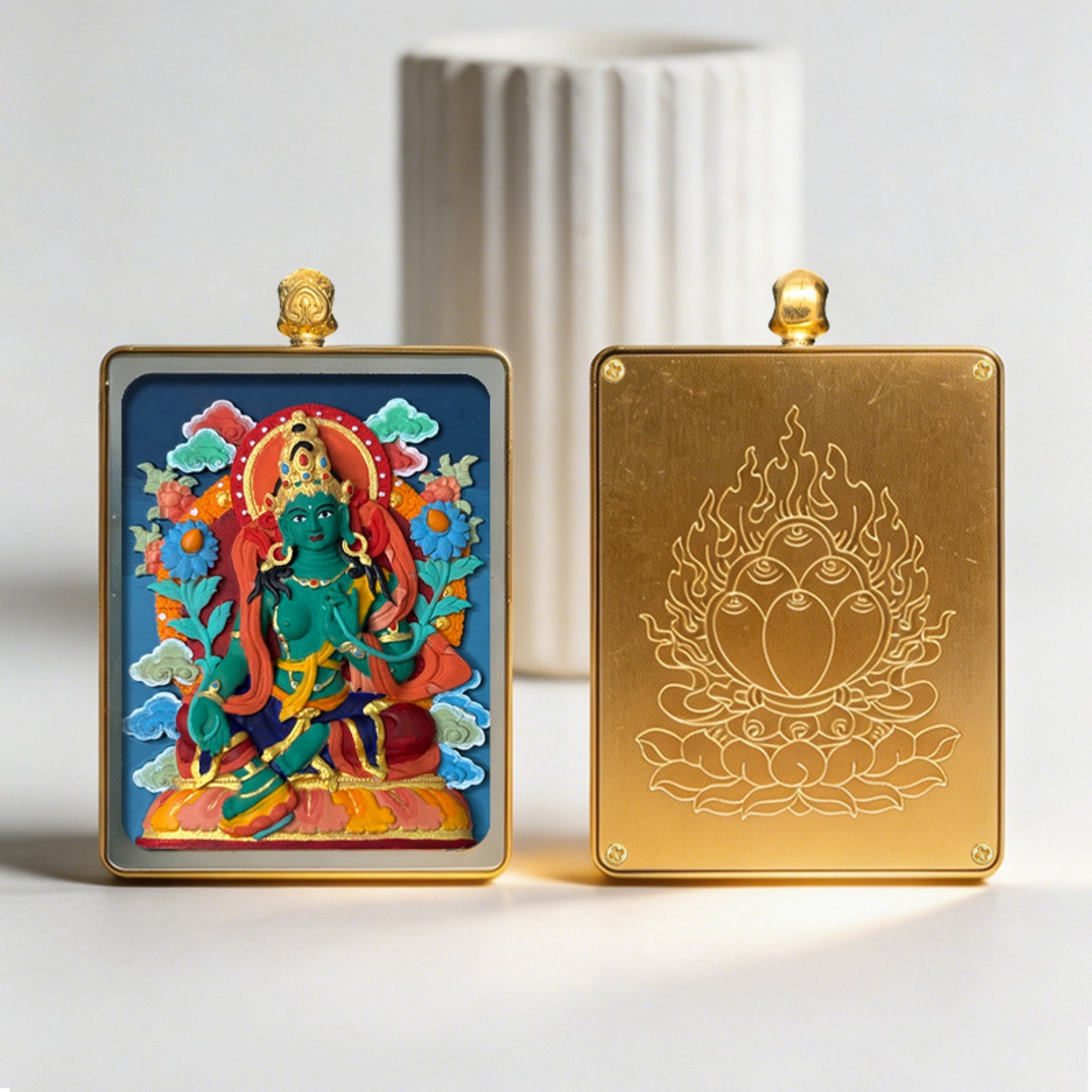 Two decorative panels, one with a colorful deity illustration and the other with a gold emblem, on a white background.