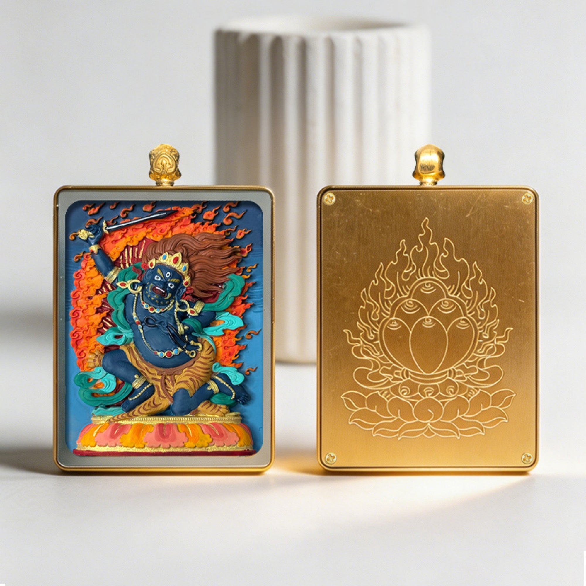 Two decorative panels, one with a colorful deity illustration and the other with a gold emblem, on a light background.